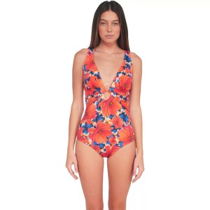 The image features a woman wearing a vibrant floral swimsuit, set against a crisp white background. The swimsuit boasts a ...